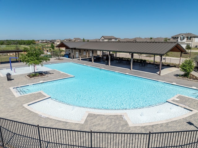 view of swimming pool with a patio