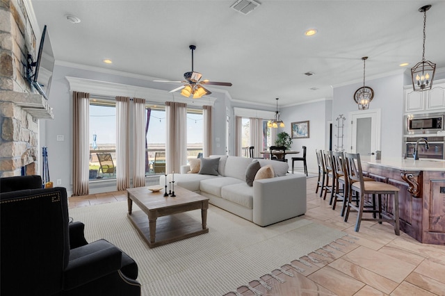 555 Mastadon Way, Weatherford, TX 76085 - living area with ornamental molding, recessed lighting, and ceiling fan