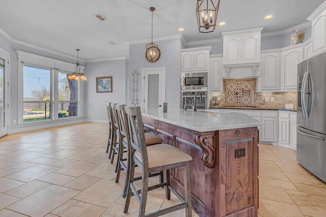 555 Mastadon Way, Weatherford, TX 76085 - kitchen featuring stainless steel appliances, a chandelier, backsplash, recessed lighting, and white cabinets