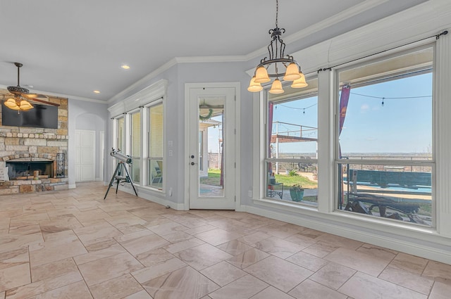 555 Mastadon Way, Weatherford, TX 76085 - unfurnished dining area with a fireplace, a ceiling fan, ornamental molding, a chandelier, and recessed lighting