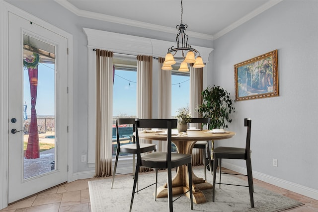 dining area with ornamental molding and a notable chandelier