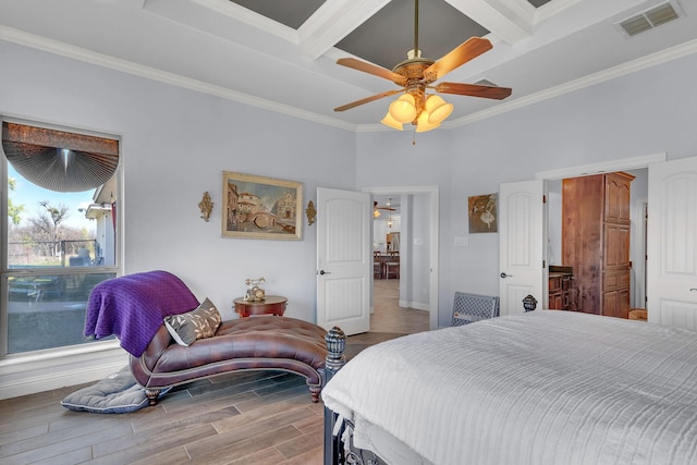 555 Mastadon Way, Weatherford, TX 76085 - bedroom featuring coffered ceiling, crown molding, wood finished floors, beam ceiling, and a ceiling fan