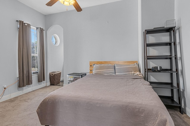 555 Mastadon Way, Weatherford, TX 76085 - carpeted bedroom with arched walkways and ceiling fan