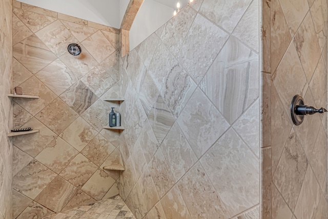 bathroom with tiled shower