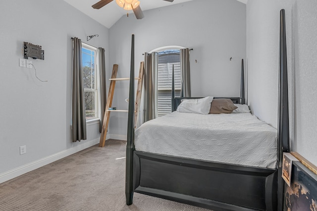 bedroom with ceiling fan, vaulted ceiling, and light colored carpet