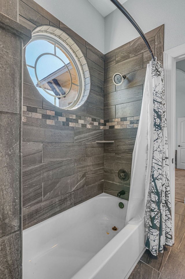 bathroom featuring shower / bathtub combination with curtain and hardwood / wood-style flooring