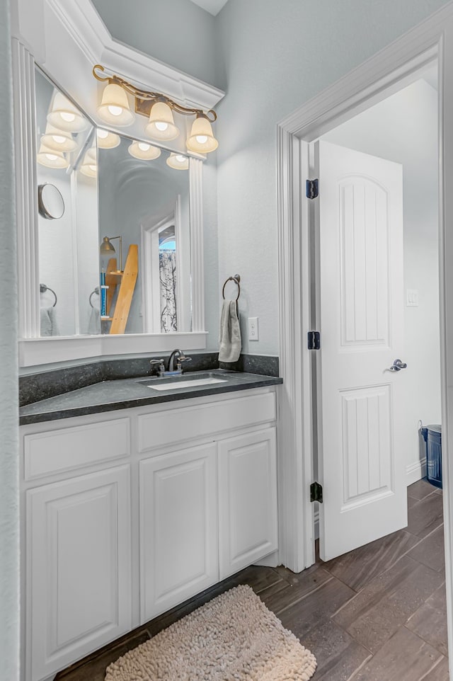 bathroom featuring wood-type flooring and vanity