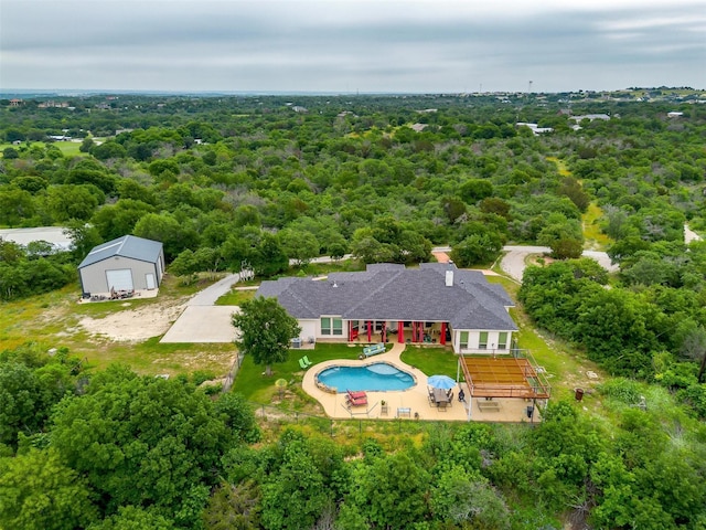 555 Mastadon Way, Weatherford, TX 76085 - view from above of property featuring a pool and a heavily wooded area