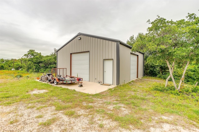 view of outbuilding featuring a garage