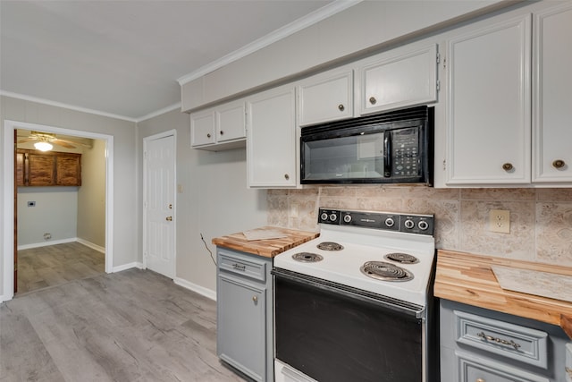 kitchen with crown molding, tasteful backsplash, electric range, and white cabinetry