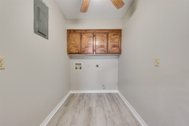 clothes washing area with electric panel, hookup for an electric dryer, cabinets, hookup for a washing machine, and light wood-type flooring