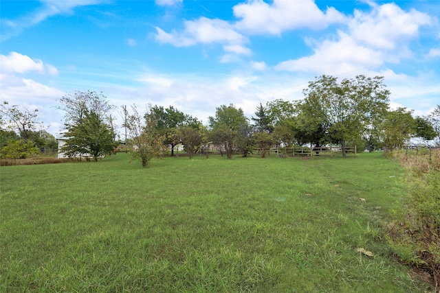 view of yard with a rural view