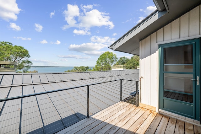 wooden deck featuring a water view