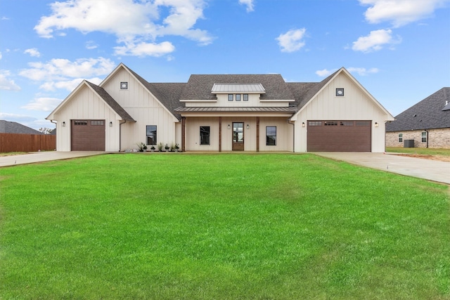 modern inspired farmhouse with a garage