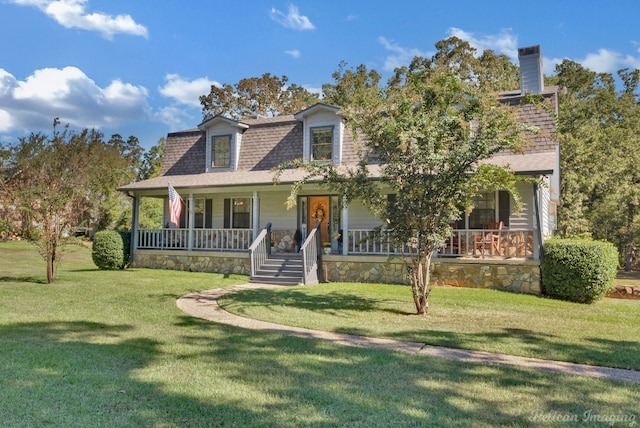 view of front facade with a porch and a front yard