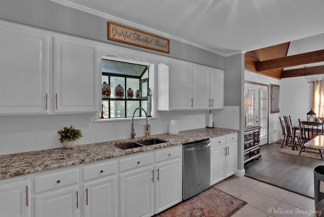 kitchen with white cabinets, sink, light hardwood / wood-style flooring, beamed ceiling, and dishwasher