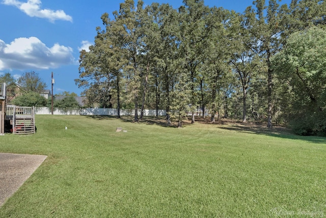 view of yard featuring a wooden deck