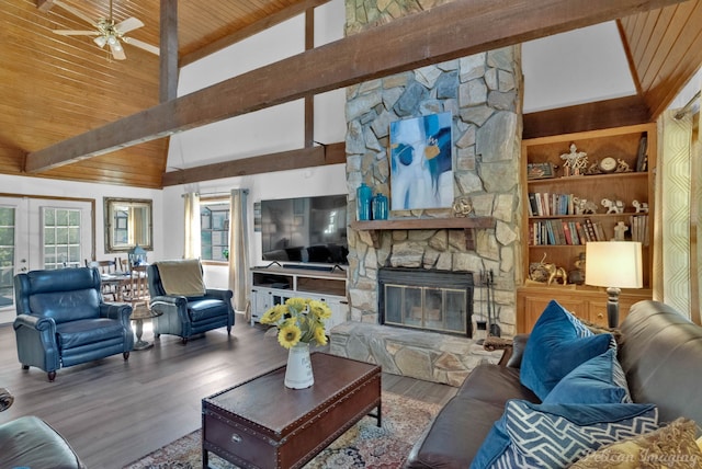 living room featuring wood ceiling, ceiling fan, a fireplace, and wood-type flooring