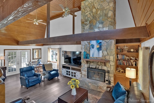 living room featuring high vaulted ceiling, french doors, a stone fireplace, wood-type flooring, and wood ceiling