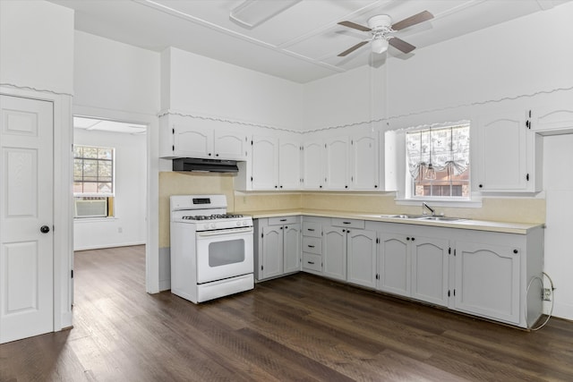 kitchen with white gas range oven, ceiling fan, dark wood-type flooring, sink, and white cabinetry