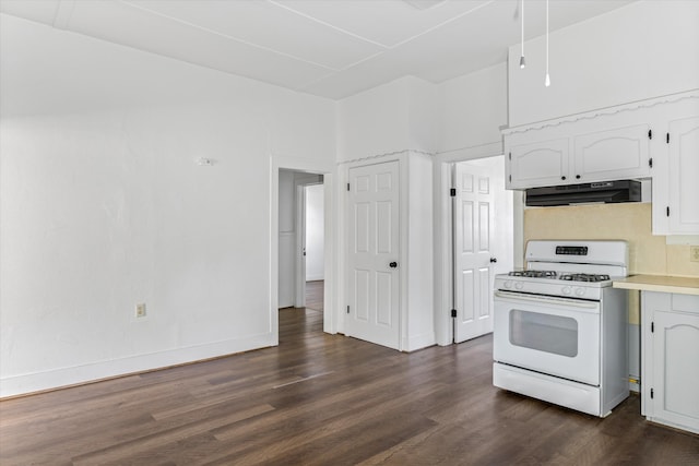 kitchen featuring white cabinetry, backsplash, dark hardwood / wood-style flooring, and gas range gas stove