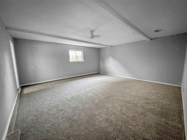 carpeted spare room with beam ceiling and ceiling fan