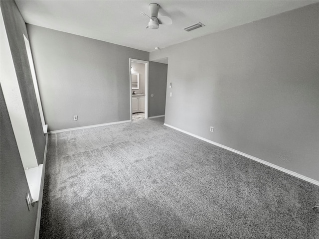 unfurnished bedroom with ceiling fan and carpet