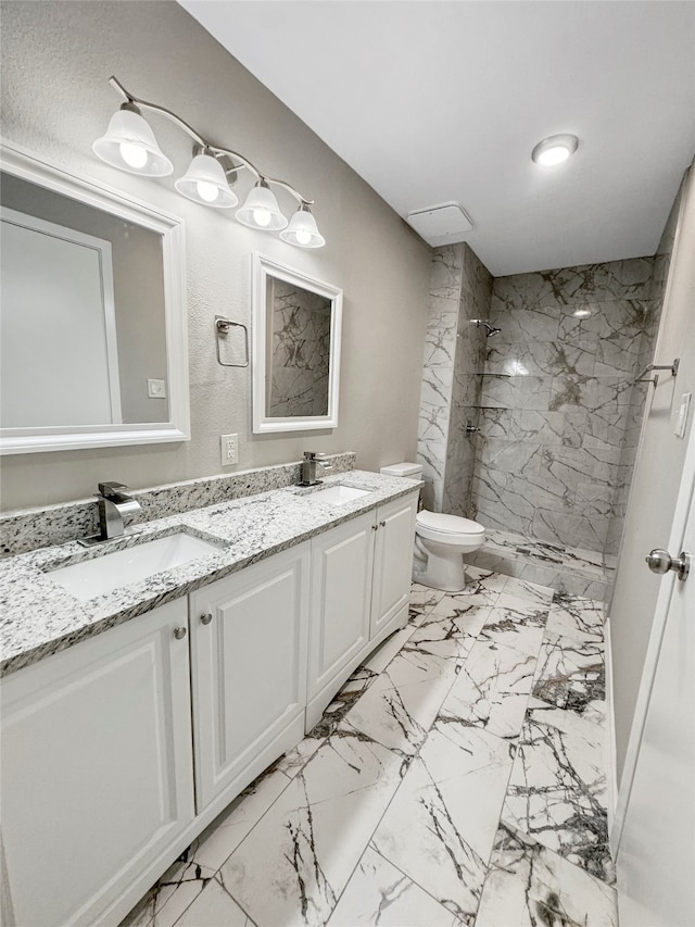 bathroom featuring walk in shower, vanity, and toilet