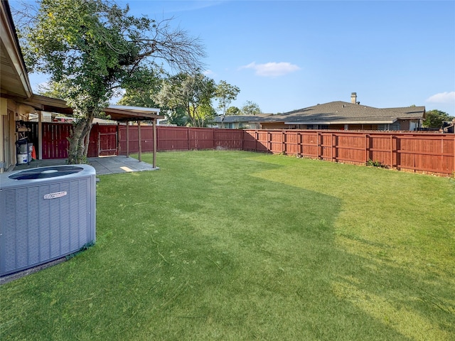 view of yard featuring cooling unit and a patio area