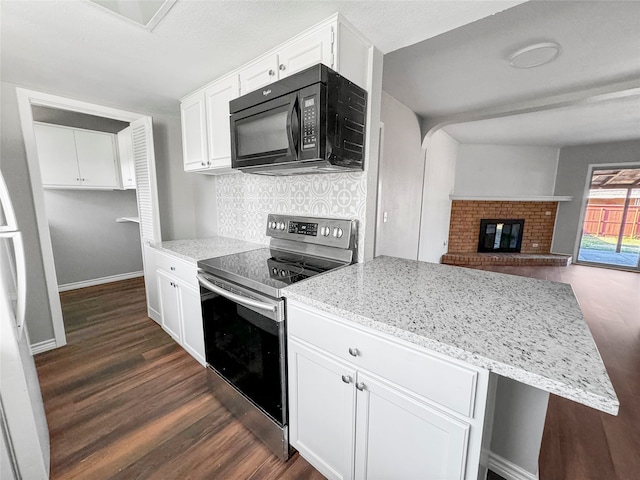 kitchen with white cabinets, stainless steel electric range, backsplash, dark wood-type flooring, and a fireplace