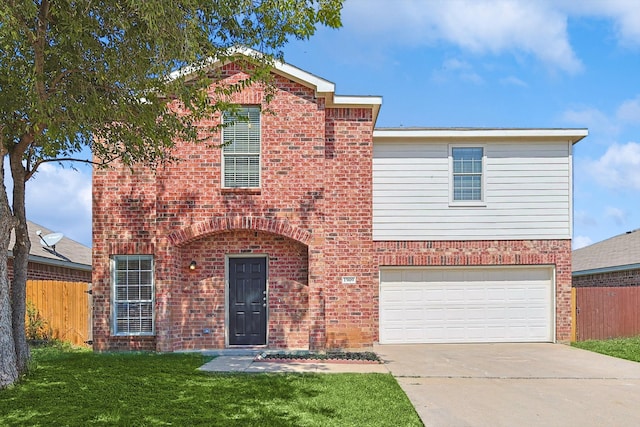 front facade with a front lawn and a garage