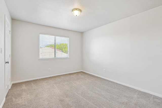 empty room with light colored carpet