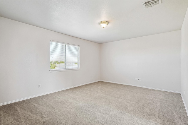 unfurnished room featuring carpet floors