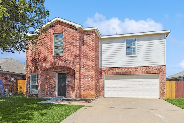 view of front facade featuring a garage and a front lawn