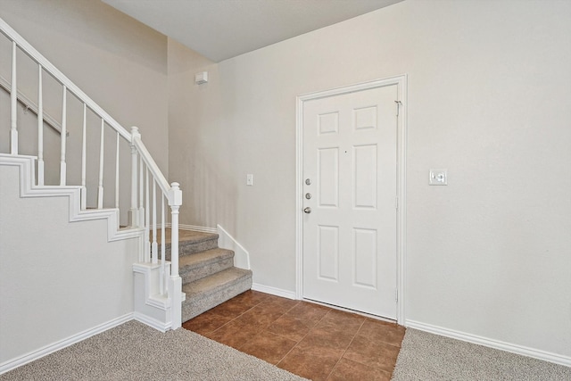 view of carpeted entrance foyer