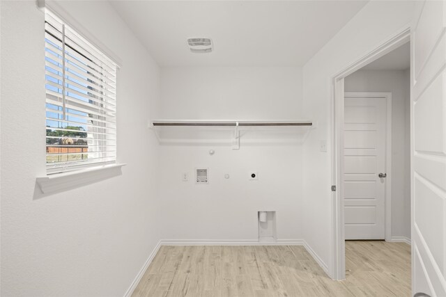 laundry room with washer hookup, hookup for an electric dryer, gas dryer hookup, and light hardwood / wood-style floors