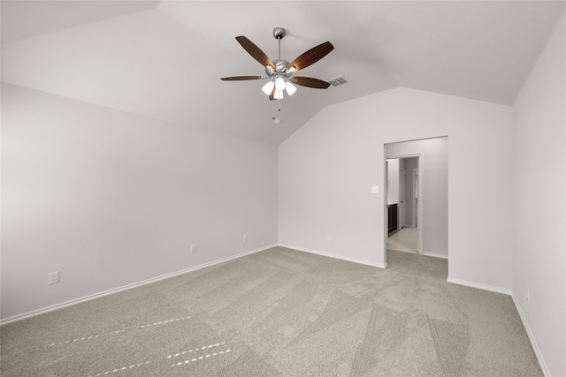 additional living space featuring light carpet, lofted ceiling, and ceiling fan