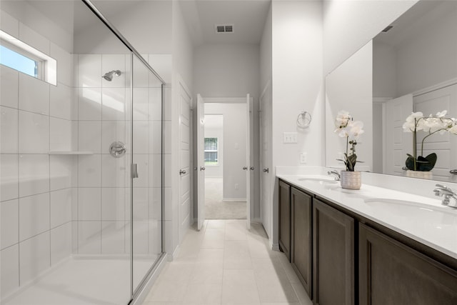 bathroom featuring vanity, tile patterned floors, and an enclosed shower