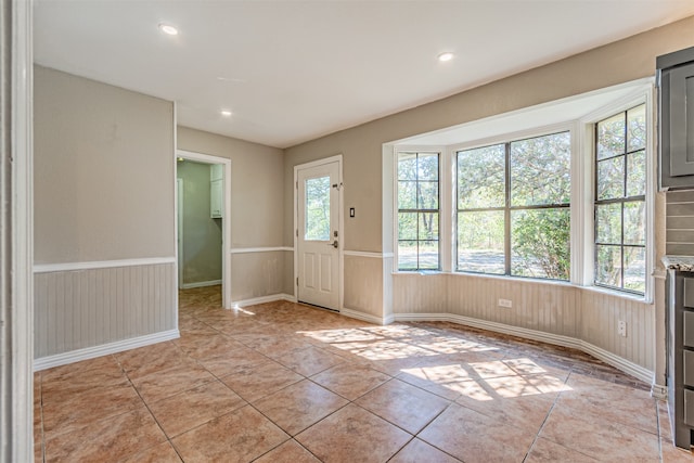 interior space with plenty of natural light and light tile patterned floors