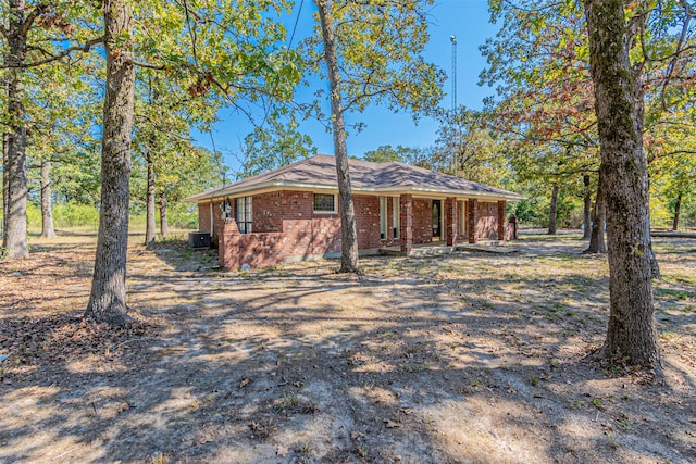 ranch-style house with central air condition unit