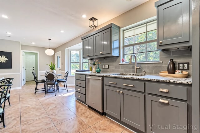 kitchen featuring a sink, gray cabinetry, light tile patterned floors, decorative backsplash, and recessed lighting