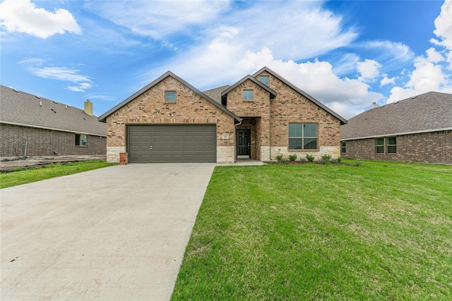 view of front of home featuring a front lawn and a garage