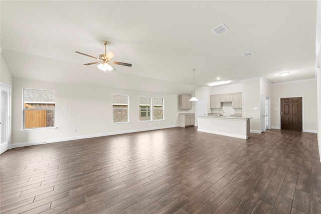 unfurnished living room featuring ceiling fan and dark hardwood / wood-style flooring