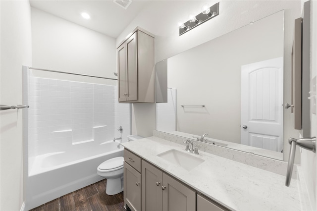 full bathroom featuring shower / bath combination, hardwood / wood-style flooring, vanity, and toilet