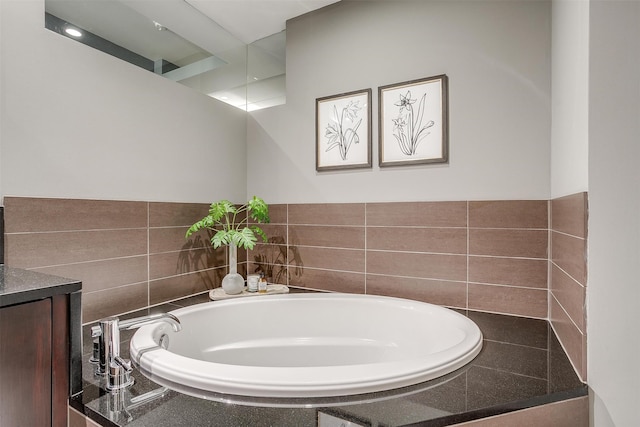 bathroom with a bathtub and vanity