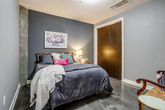 bedroom featuring a closet and dark hardwood / wood-style floors