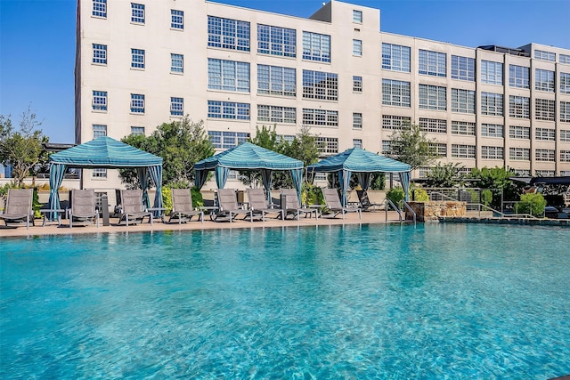 view of swimming pool featuring a gazebo