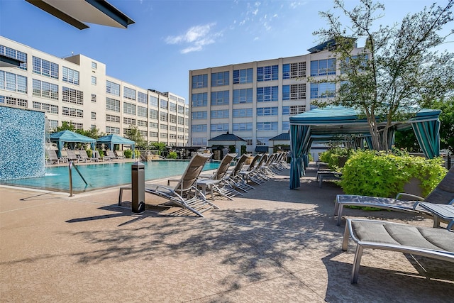 view of pool featuring a gazebo and pool water feature