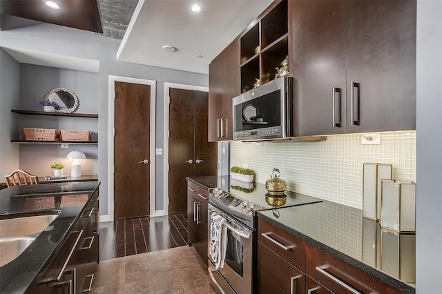 kitchen featuring dark brown cabinetry, stainless steel appliances, and dark wood-type flooring