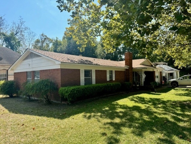 ranch-style home featuring a front yard